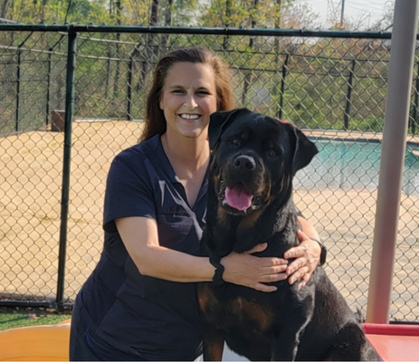 a woman holding a dog