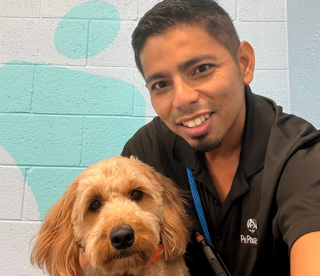 a man taking a selfie with a dog
