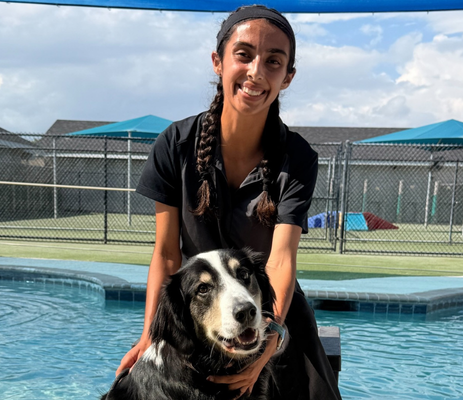 a woman with a dog in a pool