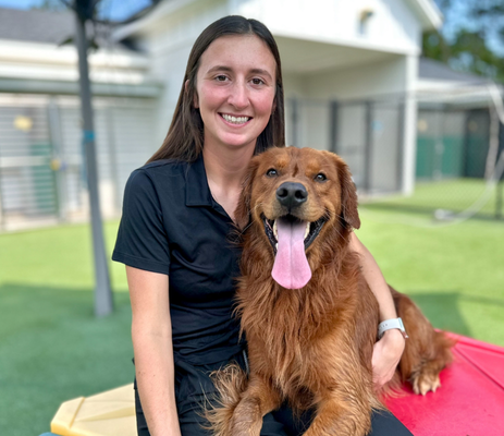 a woman sitting on a dog