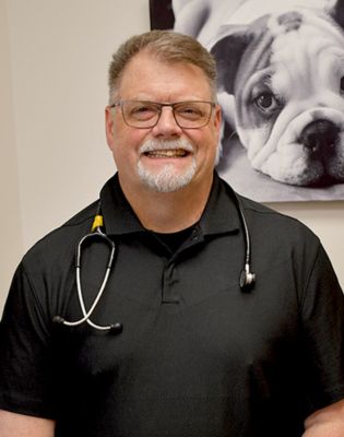 a man with a stethoscope around his neck