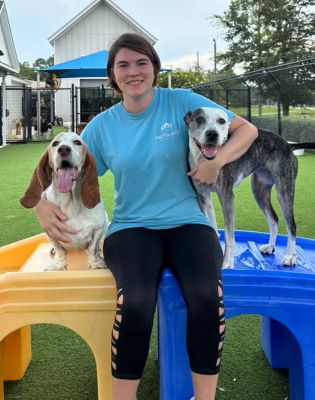 a woman holding a dog