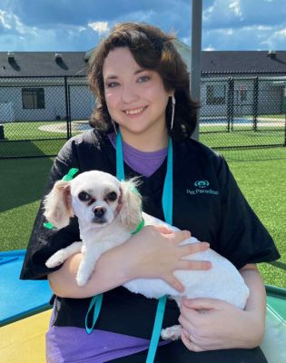 a woman holding a dog