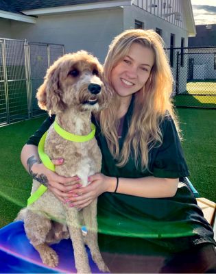 a woman holding a dog