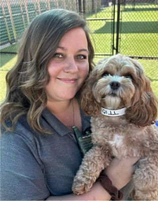 a woman holding a dog