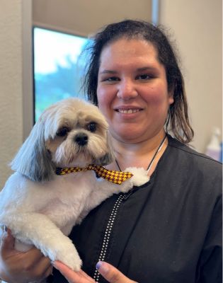 a woman holding a dog