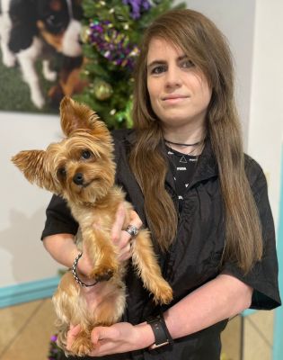 a woman holding a dog