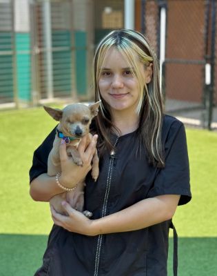 a woman holding a dog
