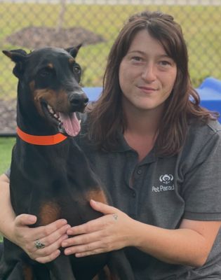 a woman holding a dog