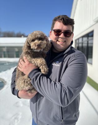 a man holding a dog