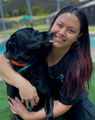 a woman holding a dog