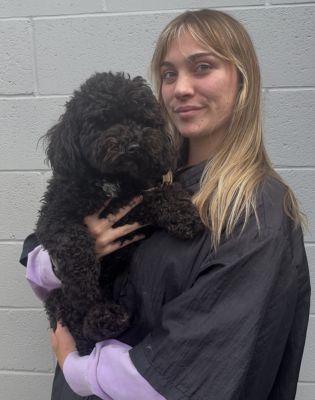 a woman holding a dog