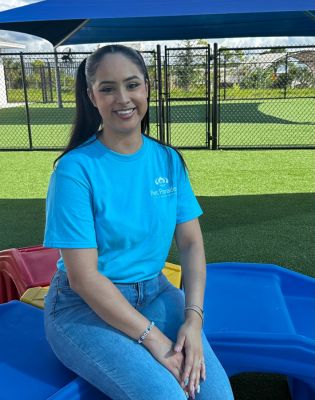 a woman sitting on a playground