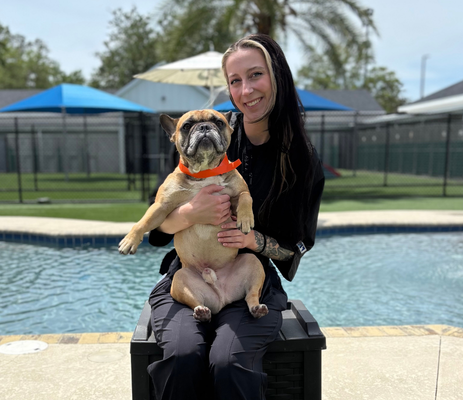 a woman holding a dog